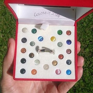 Sterling silver, 23 Interchangeable ring stones.
